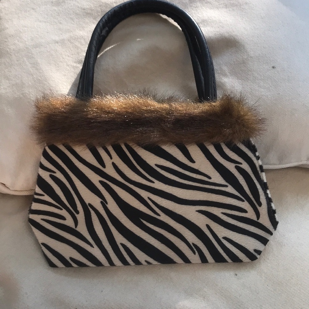 Zebra small clutch for around the top zipper shut